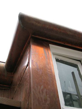 Window flashings with half-circle decorative cornice.